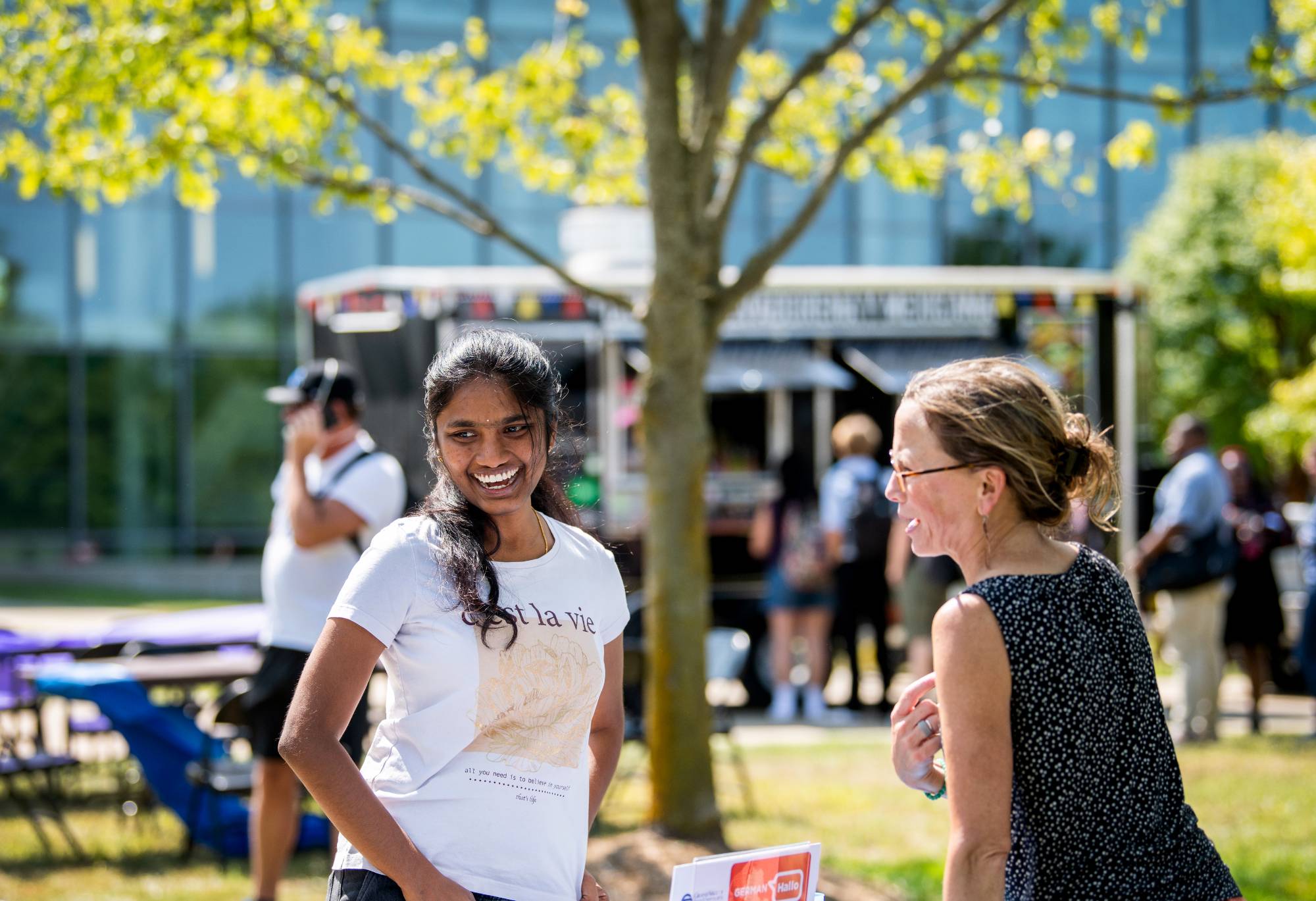 Student conversing with professor